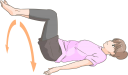 寝転がって膝を左右に倒すストレッチをする女性のイラストです。