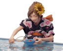 祭りで金魚すくいをする浴衣の女の子