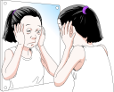 鏡を見る女性